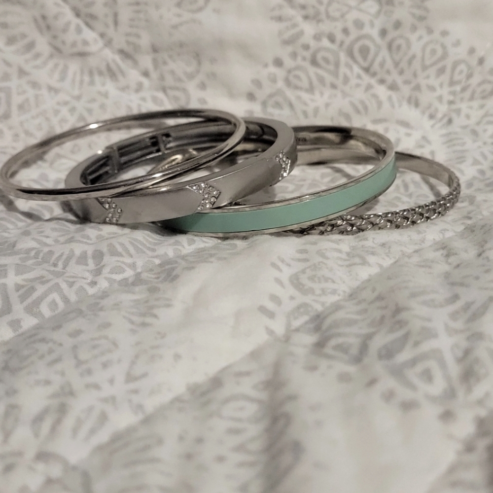 assorted silver bangle bracelets